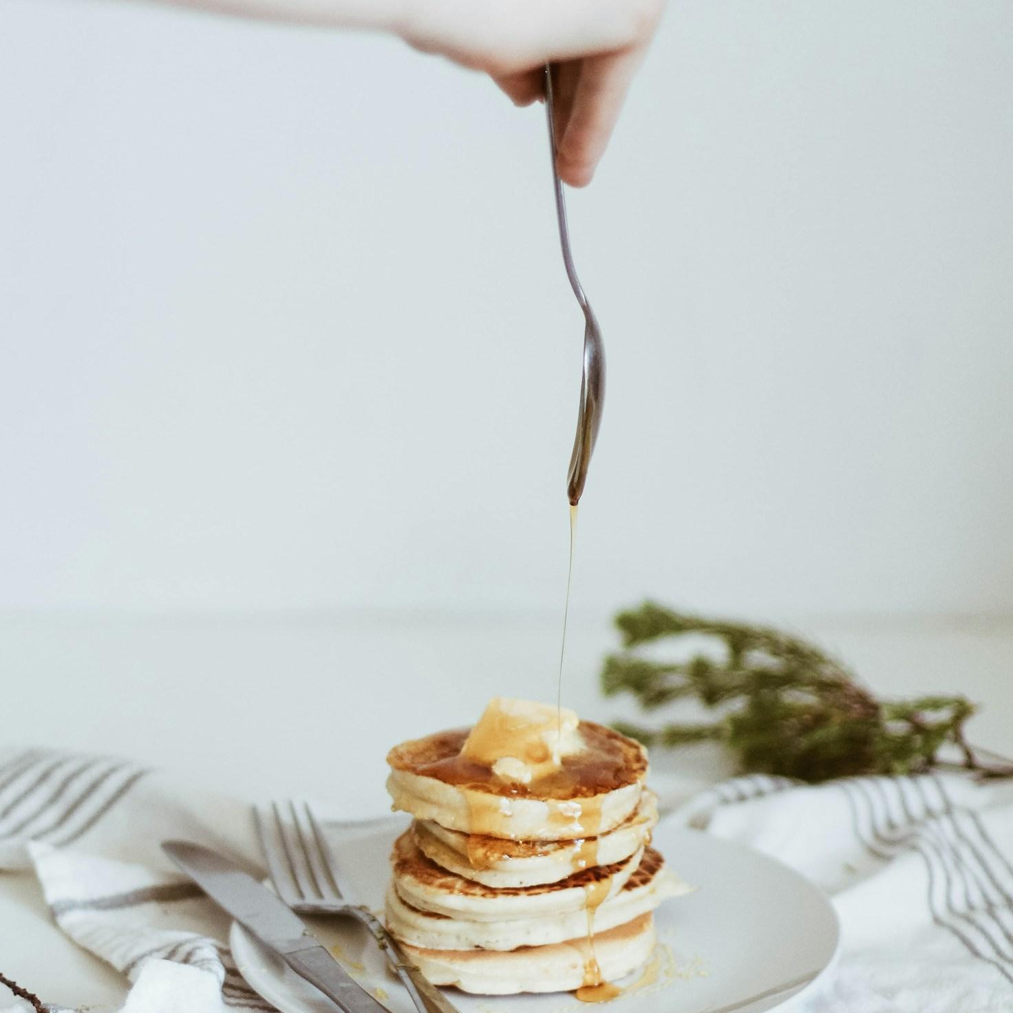 Community members collaborating in a modern kitchen space, sharing recipes and techniques